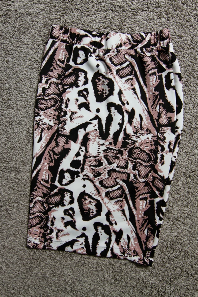 Falda de rodilla para mujer Nicki Minaj pequeña blanca negra púrpura patrón negocios informal Foto 1 de 4