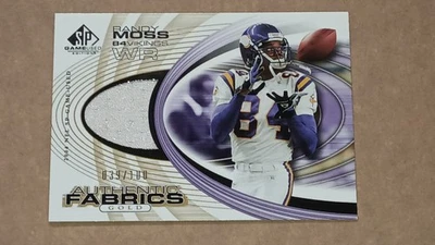 2004-SP GAME USED-RANDY MOSS AUTHENTIC FABRICS JERSEY GOLD/100-VIKINGS - Image 1 of 4