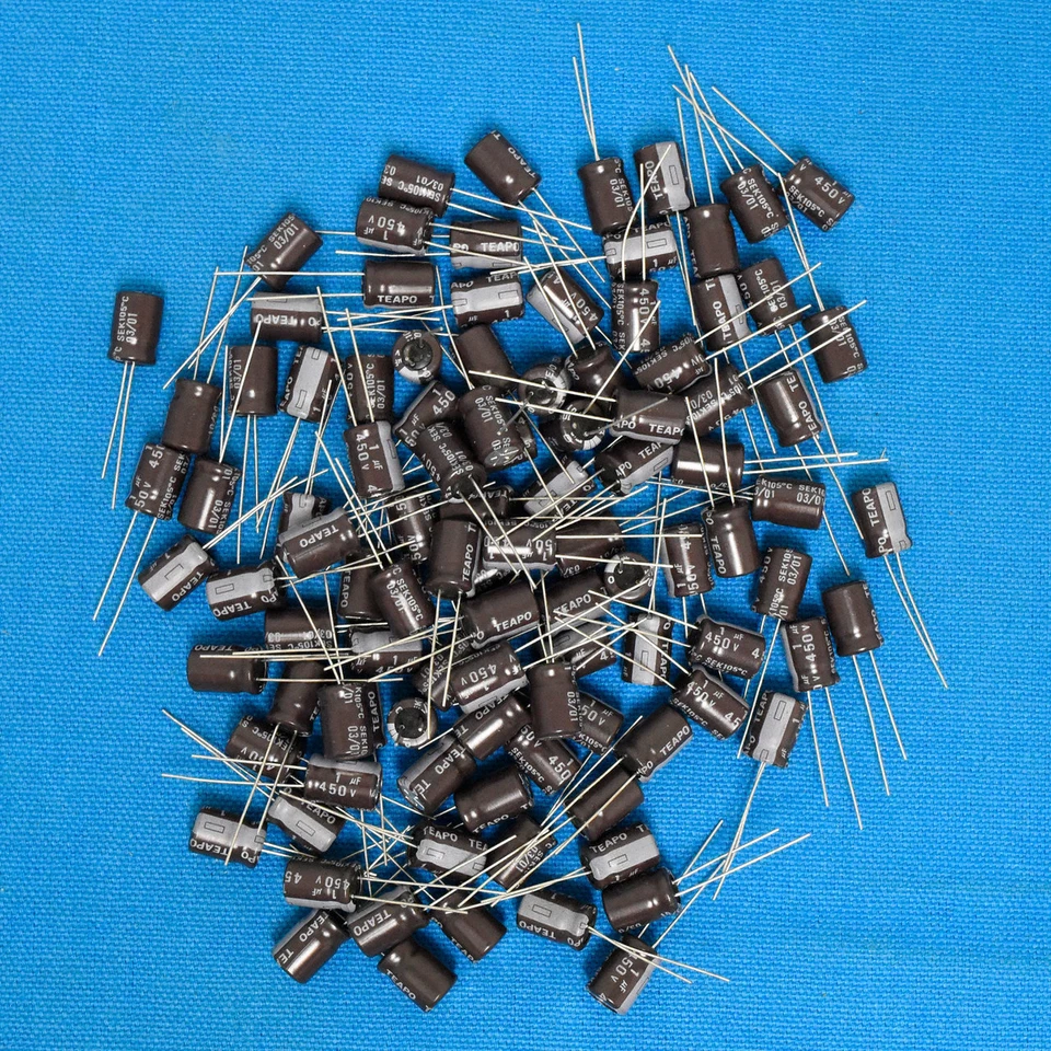 100 pcs 1uf 450V SE45DMIRDDKT9 Radial Lead Electrolytic Capacitor 105º Teapo E
