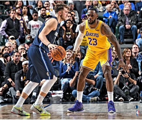 Luka Doncic Dallas Mavericks Unsigned Dribbling vs. LeBron James Photograph Cover
