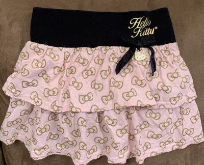 NIÑAS HELLO KITTY FALDA TALLA M ROSA CON LAZOS BRILLANTES Y ENCANTO COLGANTE  Foto 1 de 4