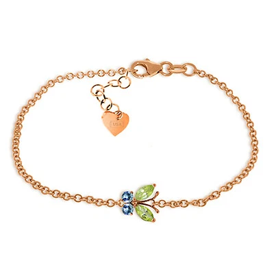 14K. SOLID GOLD BUTTERFLY BRACELET WITH PERIDOTS & BLUE TOPAZ - Image 1 of 4