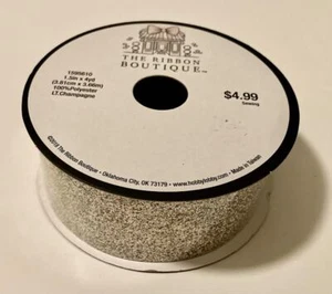 The Ribbon Boutique 1.5" x 4 yds. 100% Polyester LT. Sparkle Champagne Ribbon - Picture 1 of 3