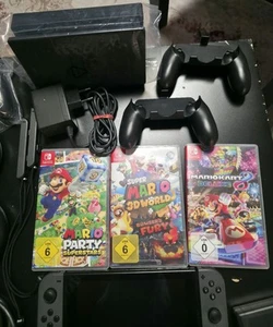 Nintendo Switch Spielkonsole - Schwarz/Grau...mit Spielen und Zubehörpaket - Bild 1 von 7