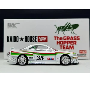 Mini GT x Kaido House 1:64 Nissan Skyline GT-R (R34) TAMIYA "The GRASSHOPPER" V1 - Foto 1 di 7