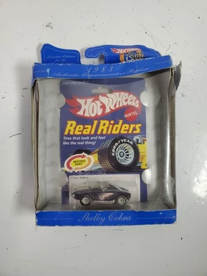 Shelby Cobra Real Riders 1983 Hot Wheels 30 aniversario - paquete dañado Foto 1 de 4