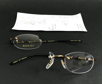 Monturas para gafas Gucci GG0857OJ 001 dorado negro sin montura bambú ovalado 52-16-135 Foto 1 de 4