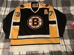 Reebok Boston Bruins Patrice Bergeron Hockey Trikot schwarz Größe 52 - Bild 1 von 18