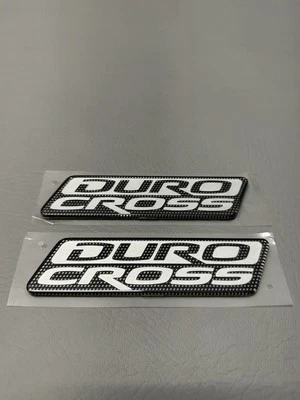 Mitsubishi Raider Duro 2006-2009 emblema de puerta lateral cruzada logotipo insignia usado conjunto OEM Foto 1 de 4