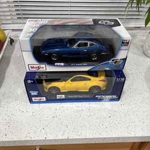 Maisto Maßstab 1:18 1971 Nissan Datsun 240Z blau & Nissan 350z gelb Postenverkauf Neu - Bild 1 von 8