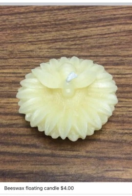 Vela flotante de cera de abejas girasol. Aroma y color natural. Mecha de algodón.  Foto 1 de 4