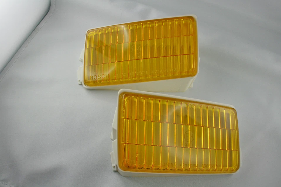 ORIGINAL BOSCH TWO YELLOW FOG LIGHT LENSES FOR PORSCHE 911 930 1984 - 1989 NEW Foto 1 de 1