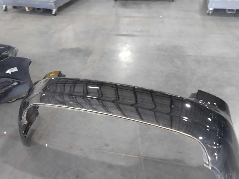 2012-2015 Volkswagen Passat Black Rear Bumper Assembly OEM 561807251 - Image 1 of 2