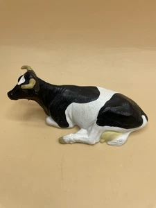 Schleich 13211 - Vaca acostada de color negro - Imagen 1 de 3