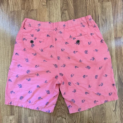 Pantalones Cortos J Caqui Niños, Talla 18, Color Coral Claro con Flores Azul Marino Foto 1 de 3