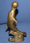 Vintage hand made brass dolphin play with ball statuette