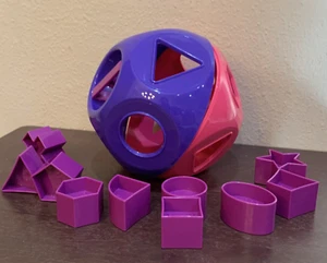 Palla giocattolo a forma di Tupperware forme gialle giocattoli didattici rosa viola nuovissima - Foto 1 di 3