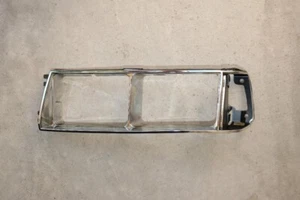 LH (Driver Side) HEADLAMP DOOR BEZEL . 85-87 MITSUBISHI GALANT MB377371 - Picture 1 of 2