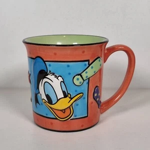 Disney Store Donald Duck Orange und Grün Tasse - Bild 1 von 9