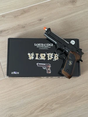 Pistola de Airsoft Resident Evil WE Tech M9 Samurai Edge completamente automática GBB - Caja abierta Foto 1 de 4