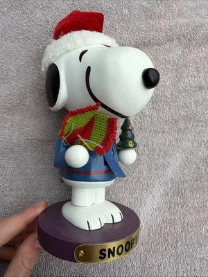 Peanuts Snoopy Wearing Santa Hat Wooden 8 Inch Christmas Nutcracker PN6801L - Image 1 of 4