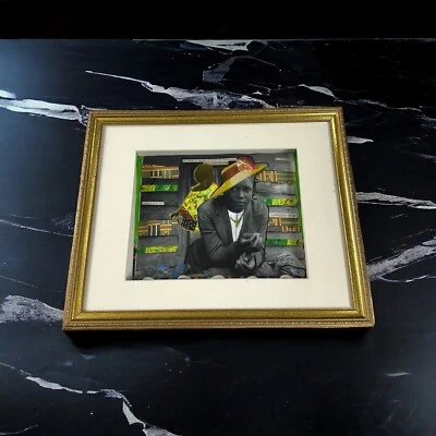 Una mezcla: collage de arte folclórico y pop conchas de moda afroamericana en caja de sombras Foto 1 de 4