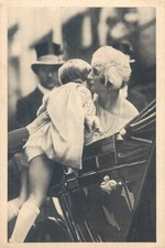 Queen Astrid blowing a motherly kiss for a Belgian child