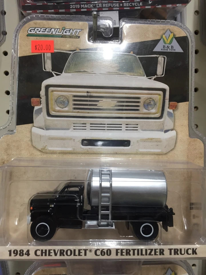 1:64 Greenlight 1984 Chevy C60 Fertilizer Truck Black - Image 1 of 1