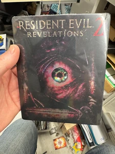 Steelbook RESIDENT EVIL 2 Revelations format blu ray neuf sous blister SON HS - Imagen 1 de 6