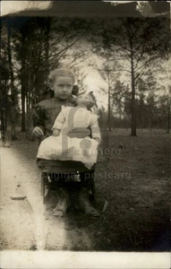 RPPC Vintage Postcard Girl with Doll Outdoors - c1910s Real Photo Postcard - Picture 1 of 5