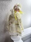 vintage 8'' porcelain doll with stand , made in china, yellow dress