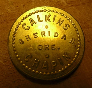 #85 – Old Brass Trade Token – CALKINS CHAPIN – SHERIDAN, ORE. - Picture 1 of 4