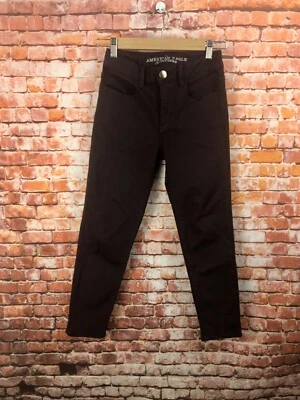 Pantalones de mezclilla para mujer American Eagle talla 0 borgoña súper elásticos tiro alto recortados Foto 1 de 4