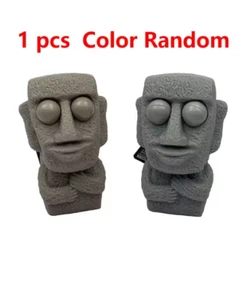 Stone man releases stress toy slowly rebounds soft Moai statue squeeze eyes inte - Bild 1 von 1
