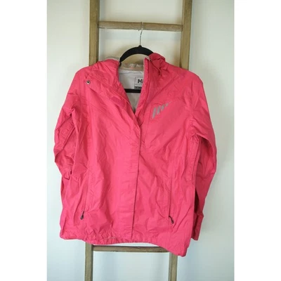 Chaqueta cortavientos Helly Hansen rosa intenso para mujer talla mediana ligera Foto 1 de 4