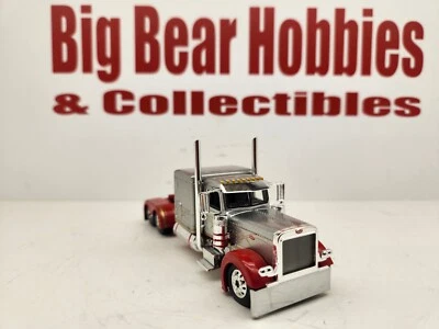 1/64 DCP Silver & Red 389 Peterbilt 63" Flattop Sleeper Tractor - Image 1 of 4