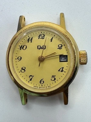 Reloj de cuarzo con fecha tono dorado Q&Q para dama piezas/reparación Foto 1 de 4