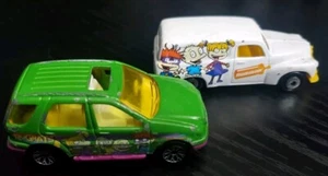 Lot Of 2 Vintage Nickelodeon RUGRATS Matchbox Holden Panel Van & Mercedes-Benz - Picture 1 of 7
