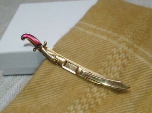 Gold tone Sword lapel clip, stamped Swank, Red Mother of Pearl Handle
