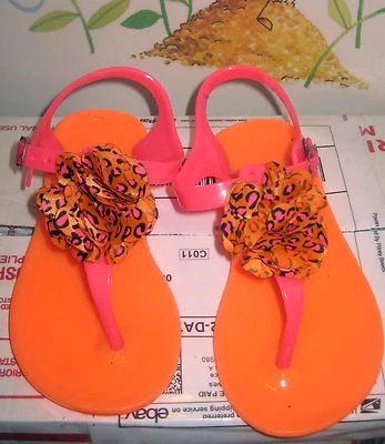 talla 9~niña joven~sandalias~jalea~naranja~ flor Pom~ ¡Muy lindo! Foto 1 de 4