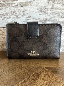 Cartera mediana Coach Signature marrón negra F23553 excelente estado - Imagen 1 de 9