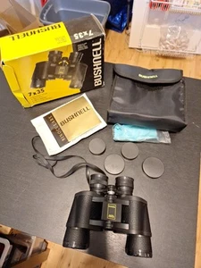 BINOCULARES BUSHNELL 7x35 INSTA-FOCUS 420 pies 1000 yardas 140 m a 1000 m CON ESTUCHE - Imagen 1 de 2
