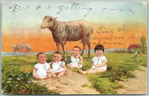 MULTIPLE BABIES MILKING SHEEP ANTIQUE POSTCARD - Picture 1 of 2