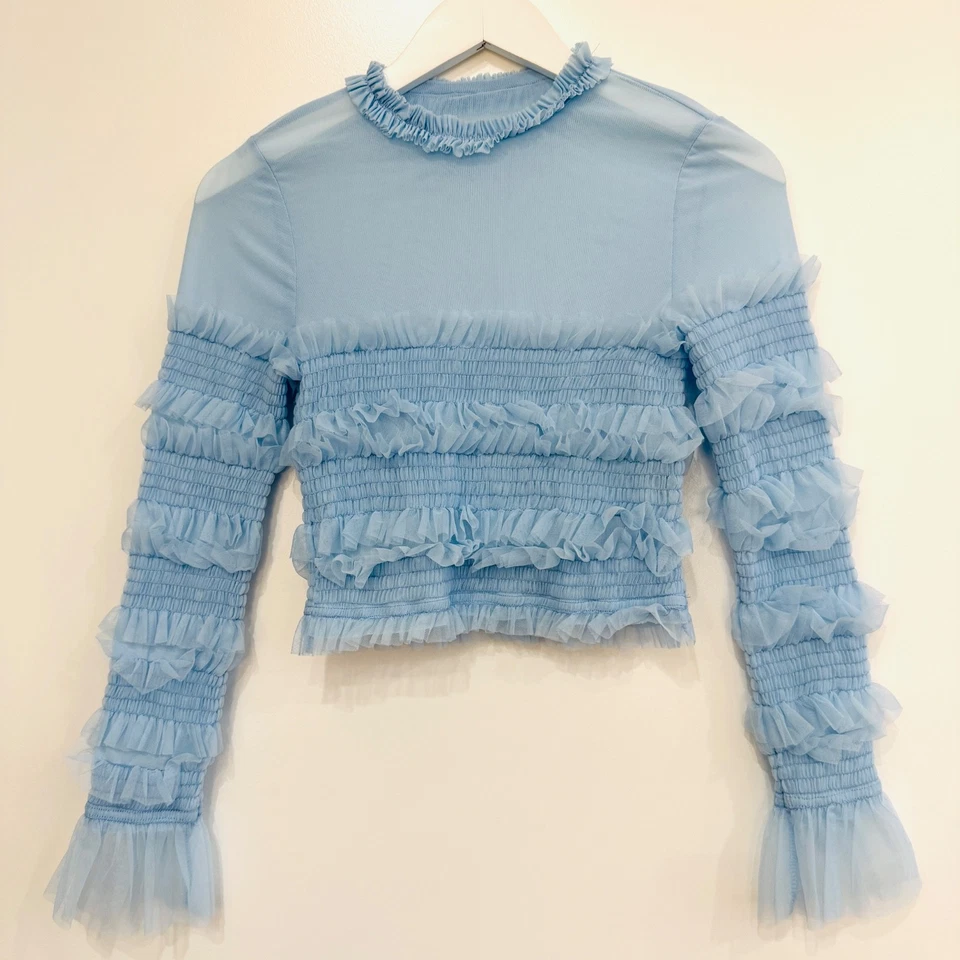 Top boho fluido isabelino azul hielo volantes toule romántico con volantes toule pequeño Foto 1 de 4