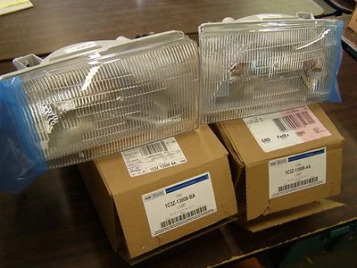 NOS OEM Ford 2002 2005 Super Duty Truck Headlights Excursion 2003 2004 F250 F350 - Image 1 of 4