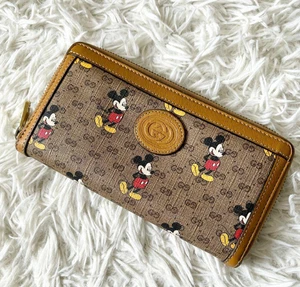 Portefeuille Gucci Disney Collaboration double pli Mickey Mouse cuir GG marron foncé - Photo 1/14