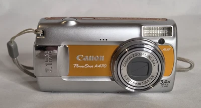 Cámara digital Canon PowerShot A470 7,1 MP con zoom óptico de 3,4x naranja/plateada Foto 1 de 4