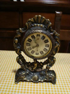 OROLOGIO MECCANICO da TAVOLO CAMINO con PUTTI - Foto 1 di 7