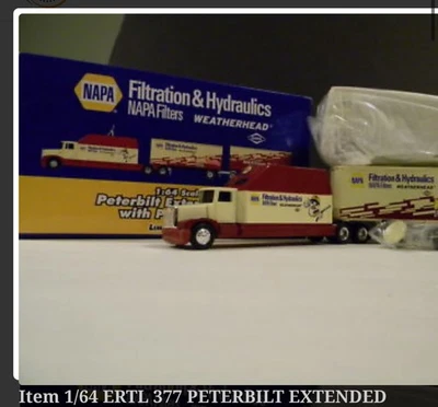 Ertl en caja PETERBILT CABINA EXTENDIDA CON REMOLQUES PARA CACHORROS FILTRO TANDUM NAPA 1:64 Foto 1 de 4
