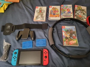 Nintendo Switch (Red and Blue) with Games and Accessories - Picture 1 of 6